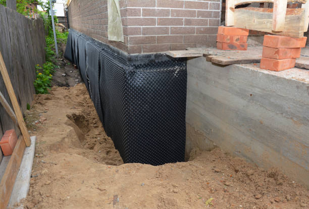 Happy homeowners after waterproofing job in Lake Village